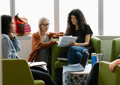 two women discussing some paperwork