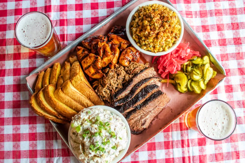 Dels Hideout executes their signature “low and slow” technique on barbeque classics including prime brisket, pork topped burgers, baby back ribs and their popular smoked meat combos.