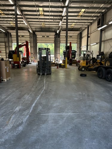 Interior of Chadwick-BaRoss Thompson service bay with heavy equipment