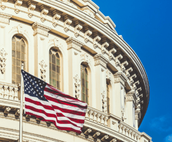 US flag flying over Capitol building