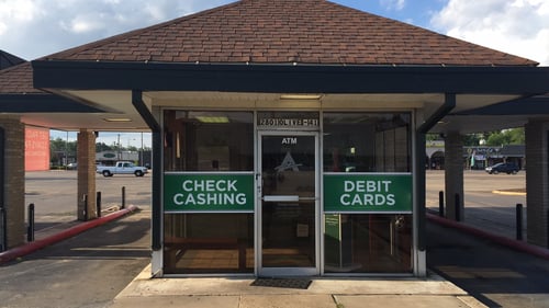 Exterior of ACE Cash Express at 2801 South Olive Street Ste 41 Pine Bluff, AR 71603, Offering Check Cashing Services and Money Order Services.