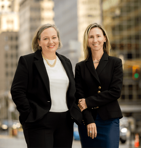 Photo of Caroline Gauthier and Pascale Leclerc with high-rise office buildings in the background.