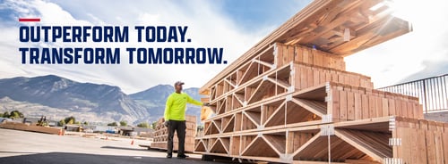 Builders FirstSource Outperform Today. Transform Tomorrow. Team member standing next to trusses.