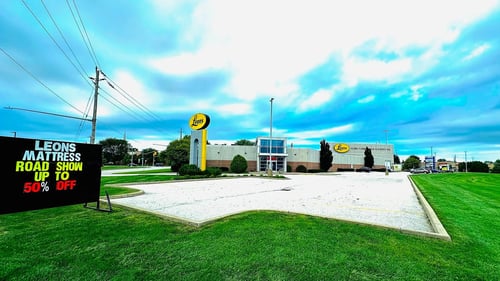 Leon's Sarnia Store on a cloudy blue day