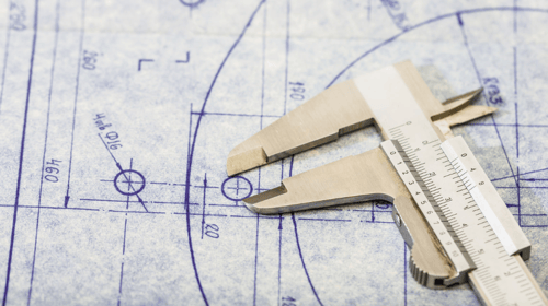 measuring tool laying on a blueprint