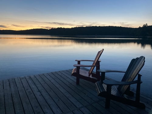 Beautiful Lake view with two patio chairs on the doc