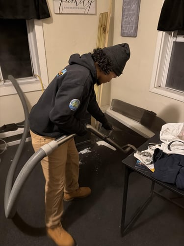 a Restoration 1 of Mt. Pocono technician extracts water from a residential property