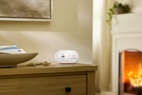 A carbon monoxide alarm on a table.
