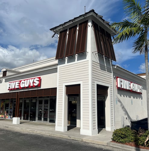 Exterior photograph of the Five Guys restaurant at 18421 NW 67th Avenue in Hialeah, Florida.
