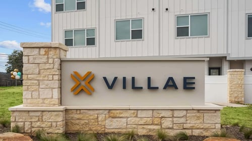 Property sign at Villae ATX Luxury Rental Townhomes in Manchaca, TX 78652