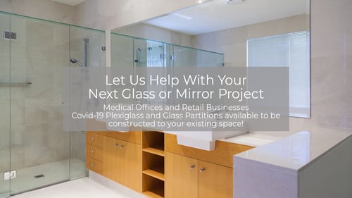 bathroom with glass shower doors and a mirror