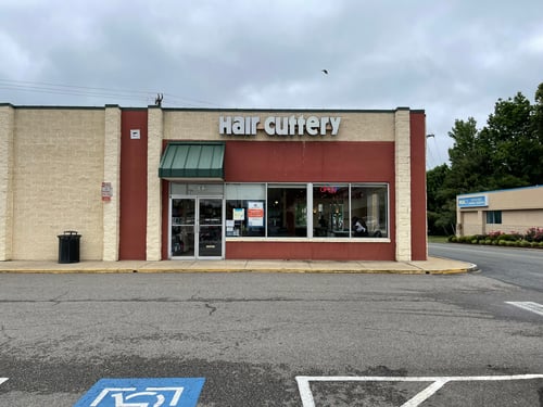 The front entrance of Hair Cuttery at Staples Mill Plaza.