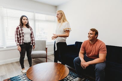 Three young adults talking