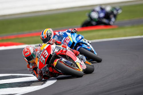 two motorcyclists on a race track