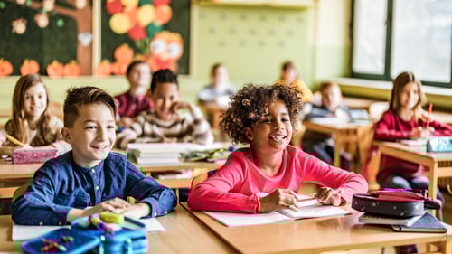 Children learning in their classroom.