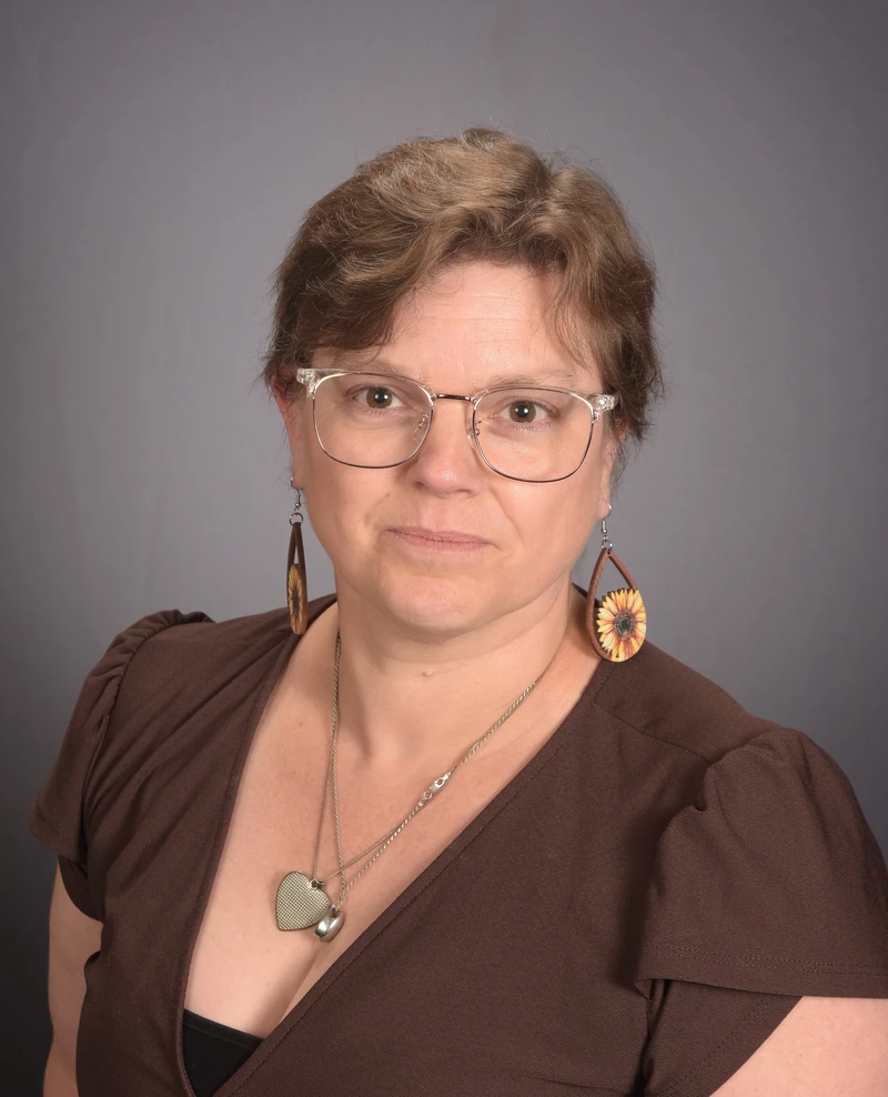 Headshot of School Director Casey Sherman