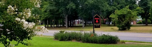 Black and red State Farm sign out front
