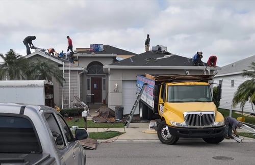 John Hogan Roofing contractors working on a roofing project
