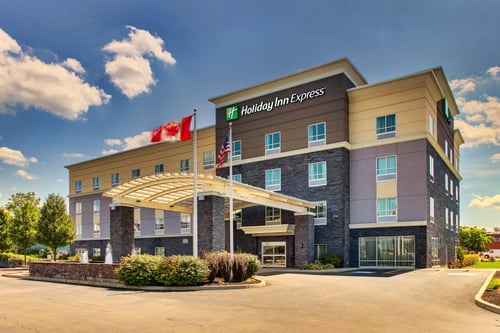 Holiday Inn Express hotel exterior with covered entry and sign