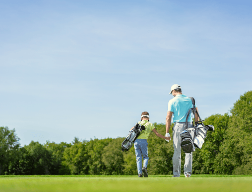 Father and son on golf course