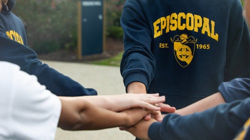 students in a huddle
