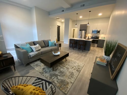 Living room and kitchen at The Georgian Apartments in St Louis, MO 63104