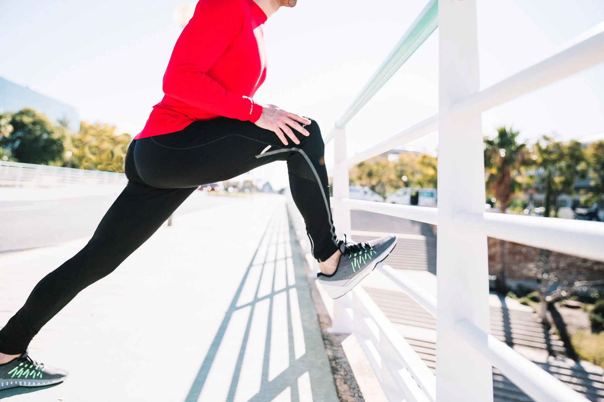 person stretching outdoors