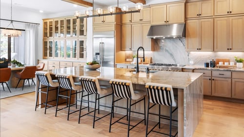 Chef-inspired kitchen with with expansive island and casual dining space