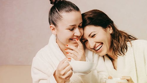 Two friends enjoying a cup of tea in the Quiet Room at Woodhouse Spa.