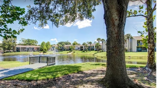 Lake view in front of The Fountain at Deerwood Apartment in Jacksonville Florida