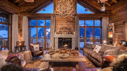large family room with stone fireplace
