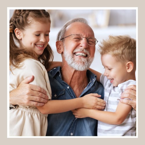 grandpa hugging his grandkids