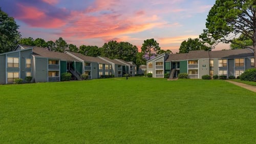 A row of houses with green lawns in front at The Onyx Apartments, Huntsville, Alabama