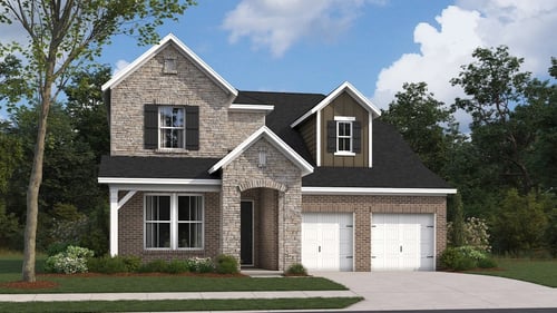 two-story home with brick exterior and double garage