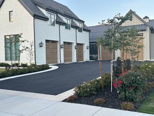 Image of a large 6-port garage and its driveway