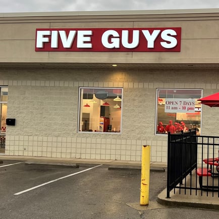 Exterior photograph of the Five Guys restaurant at 1780 Tiffin Avenue in Findlay Ohio.