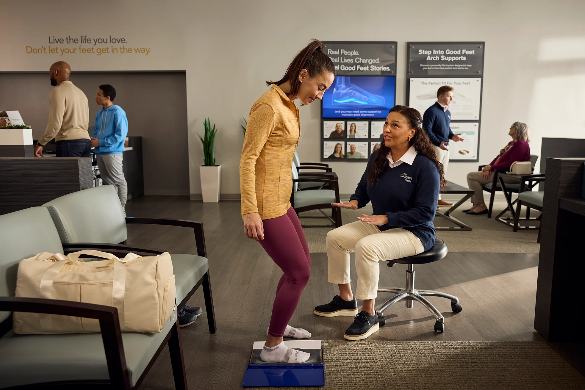 Person getting a personalized fitting at The Good Feet Store with Arch Support expert