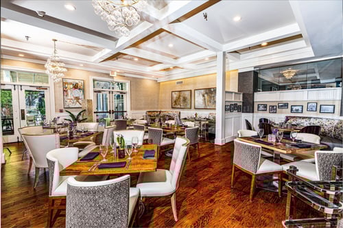 Dining tables arranged in Lake City Bistro at Inn at the Crossroads