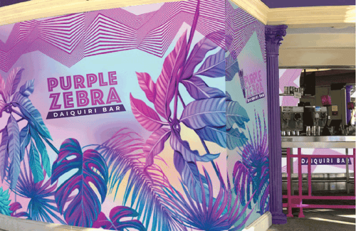 Situated near the "Absinthe" show tent, soak in the upbeat ambiance at this patio bar in front of Caesars Palace Las Vegas. Enjoy a variety of frozen fruit cocktails amid the unparalleled people-watching at Roman Plaza. Choose from a multitude of flavors and spirits or add extra shots to your drink of choice.  you prefer to do your people watching outdoors, Purple Zebra is a great place to grab a drink and settle in. This is a vibrant and bustling place equipped with a misting system to keep it cool on a hot summer day.