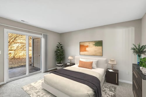 A bedroom bed and brown blanket at Waterfront Pointe, Indianapolis, IN