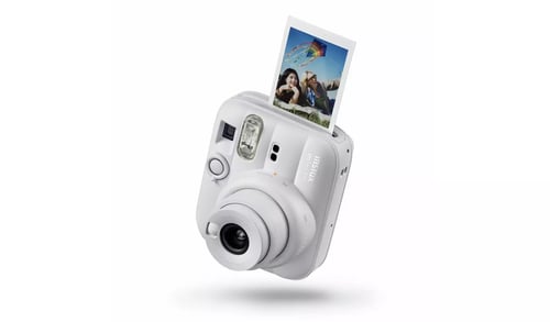 White instant print camera with printed photo