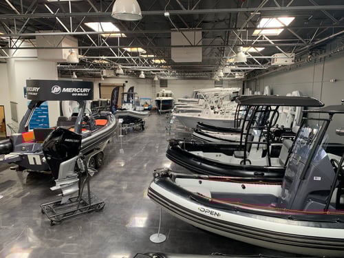 Boat Specialists showroom showcasing boats by top brands like Sea Fox, Barletta, Zodiac, AB, Avon, Achilles, Yamaha, Mercury, Tohatsu, and Honda.