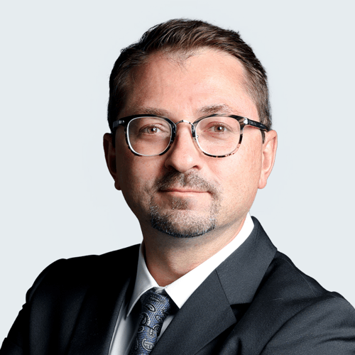 Headshot of Adam Littlejohn.
