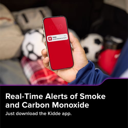 An image of a person holding their phone showing a notification. Text below reads Real-time Alerts of Smoke and Carbon Monoxide, just download the Kidde app.