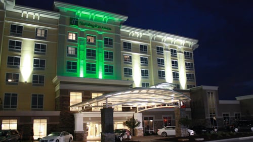 Evening view of the Holiday Inn and Suites Davenport.