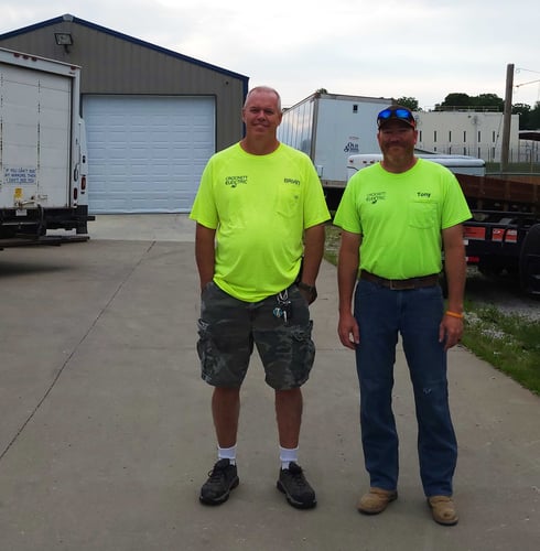 Brian Crockett and Tony Keithly standing in front of the Crockett Electric commercial building.