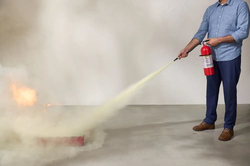 Person putting out fire