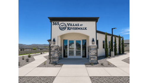 The entrance to a building with the sign "365 VILLAS AT RIVERWALK" in front of it at Riverwalk in Camp Verde, AZ, 86322