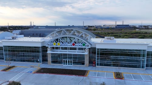 storefront of Rooms To Go home furniture showroom in Allen, TX with large windows and a large logo