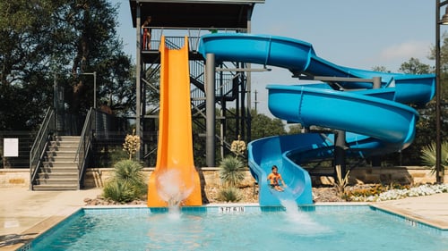 Enjoy resort-style recreation at the Ranch House, featuring a leisure and lap pool, dual waterslides, and more